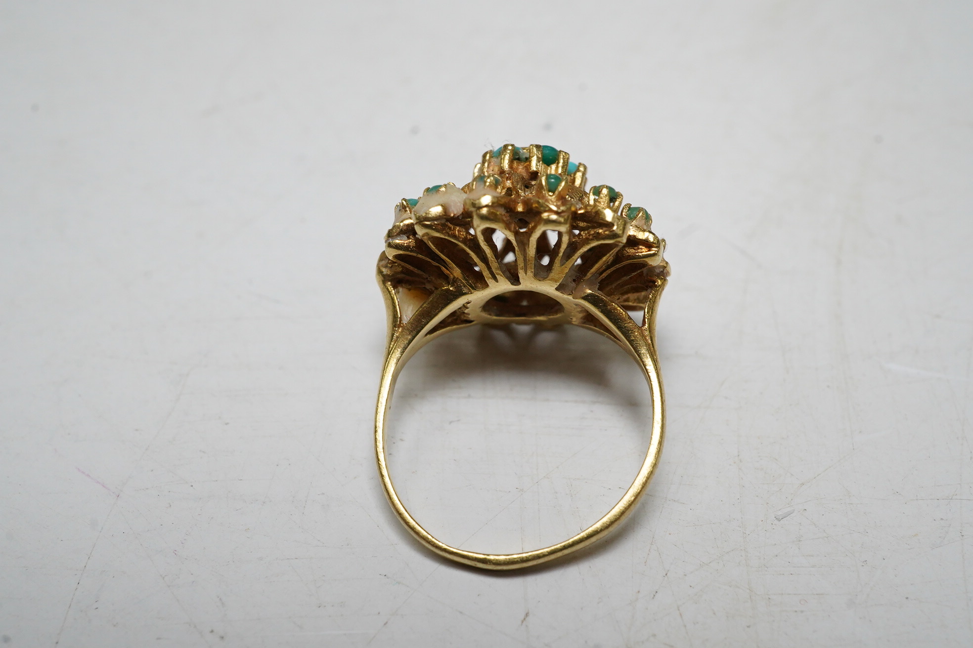 An 18ct gold and turquoise dress ring, gross 7.3 grams, and a turquoise set brooch stamped 750, gross 10.5 grams Condition - fair.